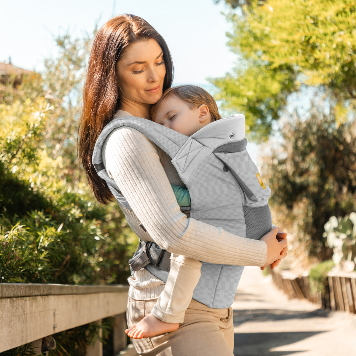 mom carrying baby in carryon airflow dlx in quarry