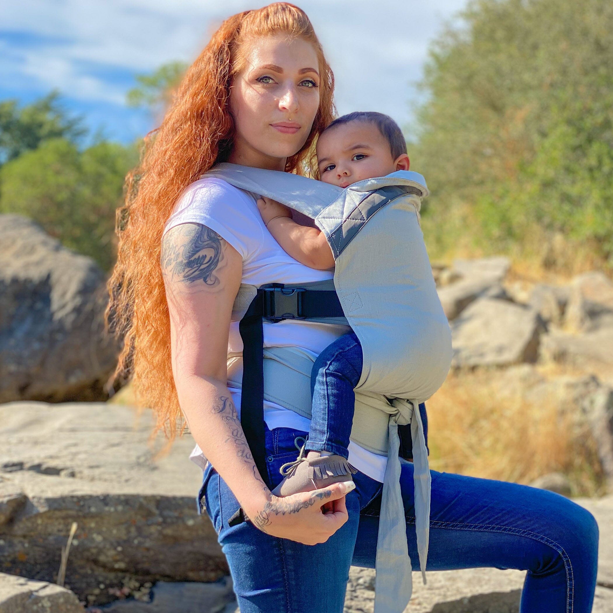 mom wearing baby in LÍLLÉlight in Pebble