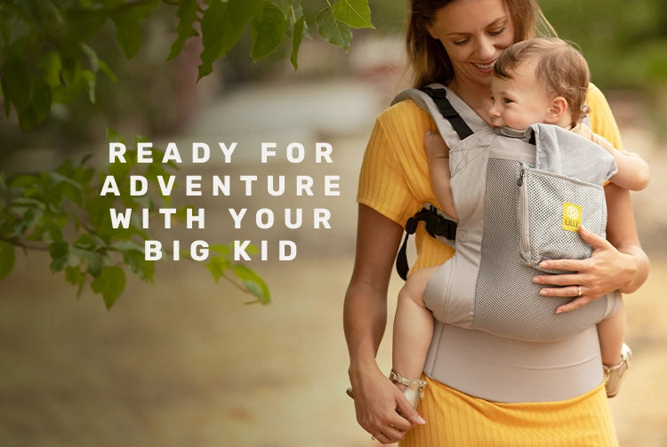 ready for adventure with your big kid. mom wearing baby in carryon toddler carrier in stone