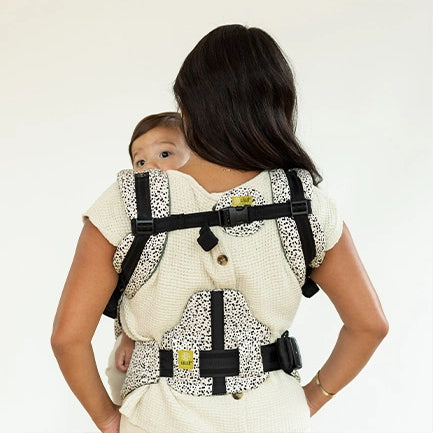 mom wearing baby in complete all seasons carrier in salt and pepper