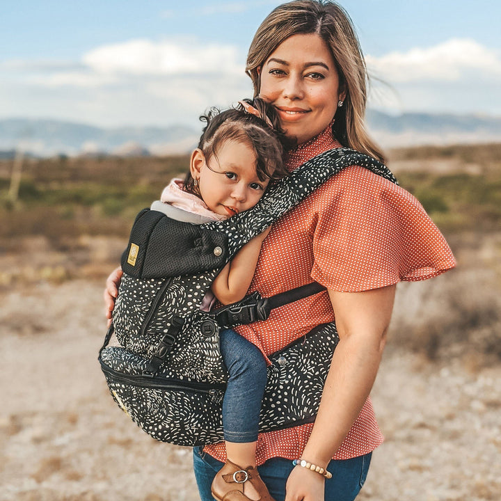 mom wearing baby in lillebaby seatme all seasons baby carrier in plume