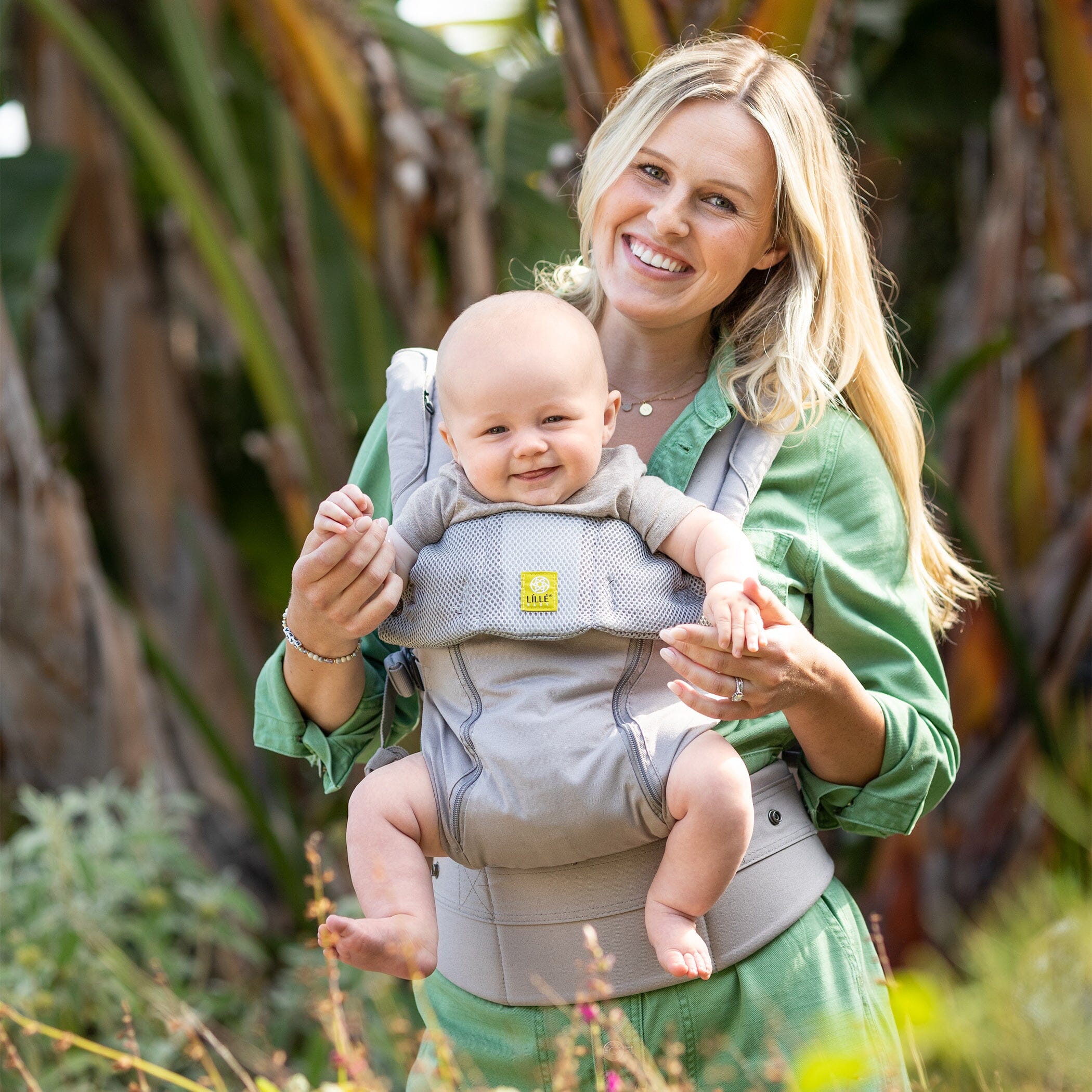 mom wearing baby in complete all seasons stone baby carrier