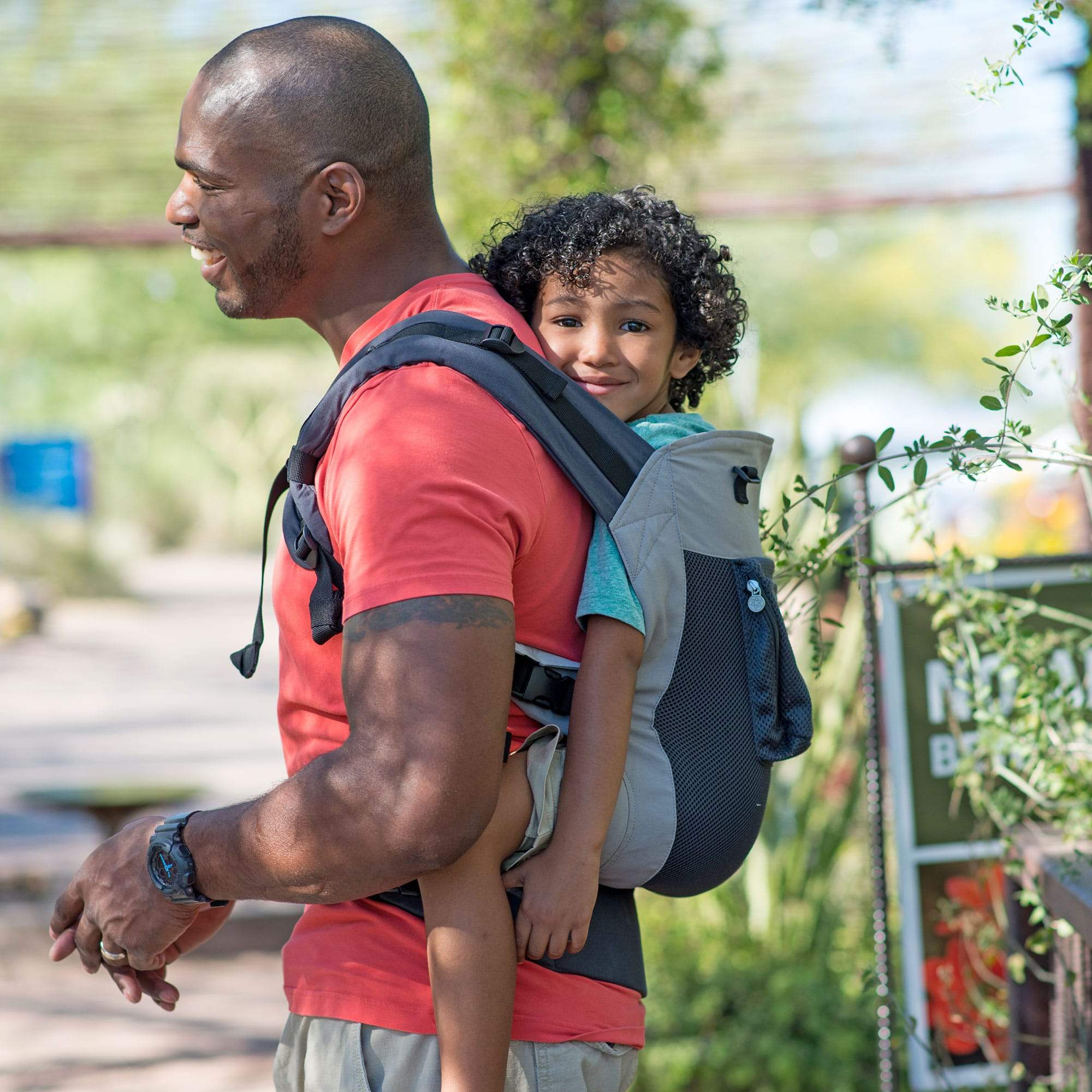 dad wearing baby in carryon aiflow baby carrier in charcoal silver