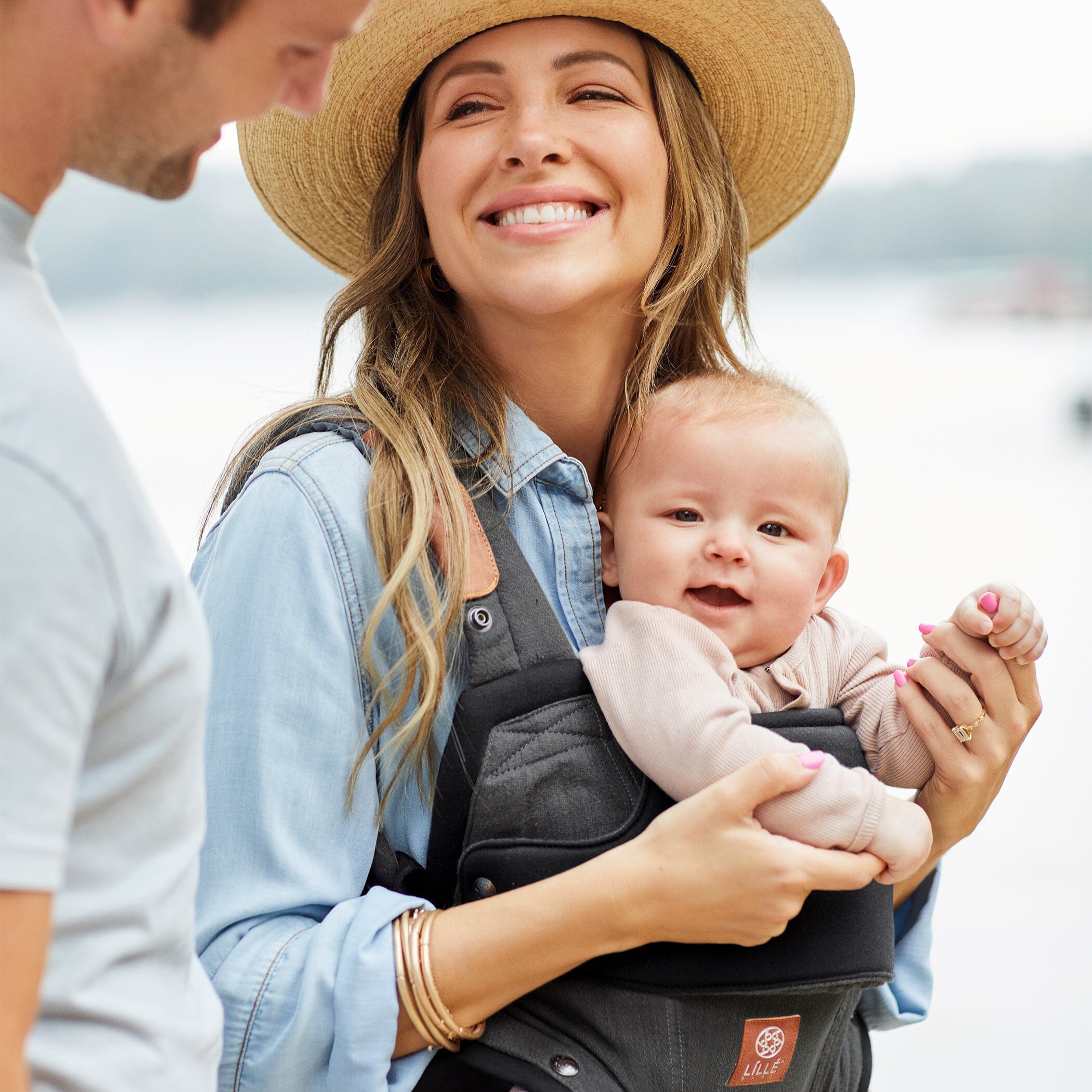 Mom wearing baby in Elevate in Pewter