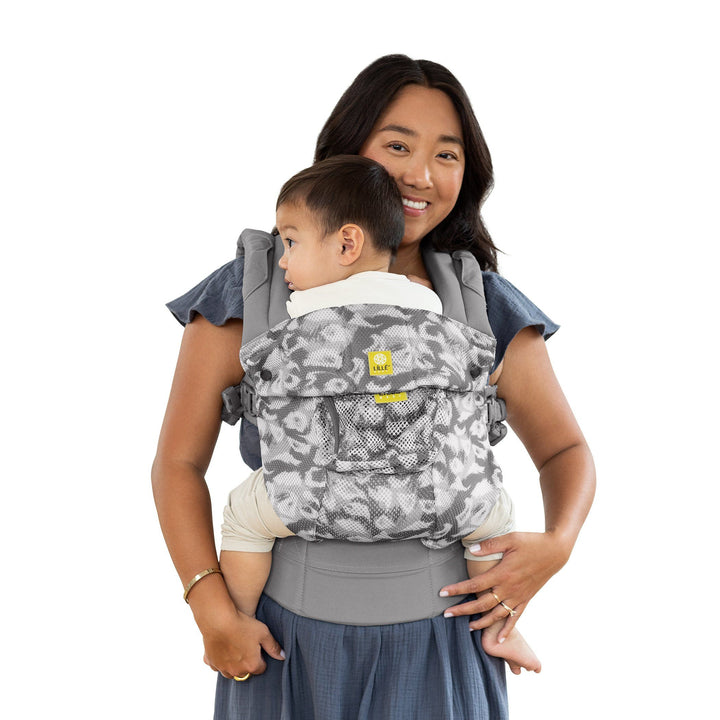 mom wearing baby in lillebaby complete airflow baby carrier in frosted leopard