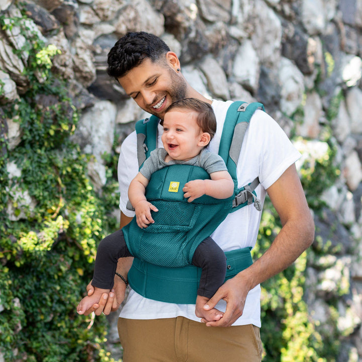 dad wearing baby in lillebaby complete airflow baby carrier in pacific coast