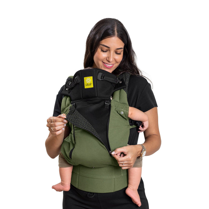 mom wearing baby in lillebaby complete all seasons baby carrier in succulent