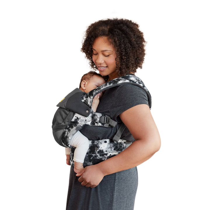 mom wearing baby in lillebaby complete airflow dlx baby carrier in galaxy space dye