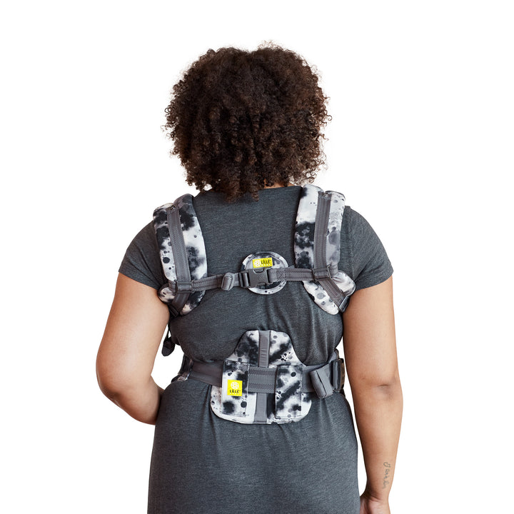 back image of mom wearing baby in lillebaby complete airflow dlx baby carrier in galaxy space dye