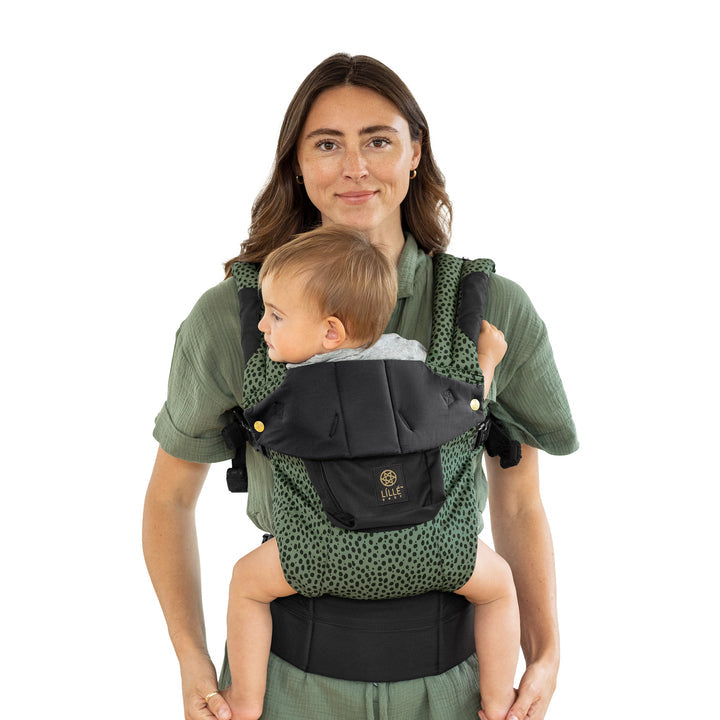 mom wearing baby in lillebaby complete luxe baby carrier in speckled succulent