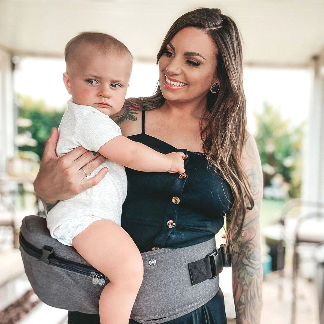 Mom wearing LILLEBaby SeatMe Hip Seat Carrier with Child