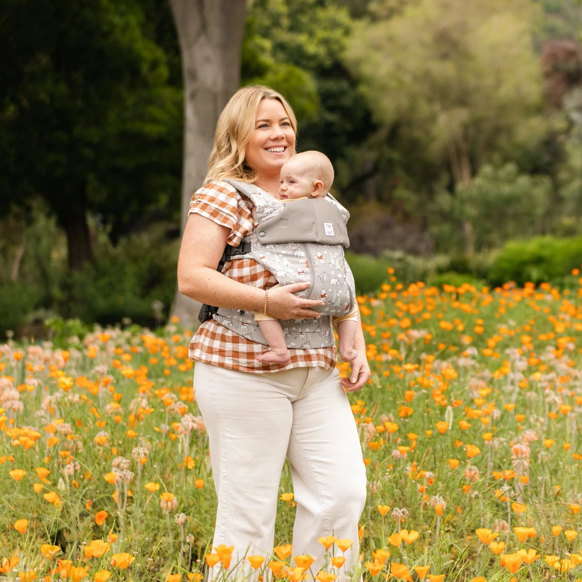 mom wearing baby in Complete 6-in-1 All Seasons in Pooh's Perfect Day baby carrier