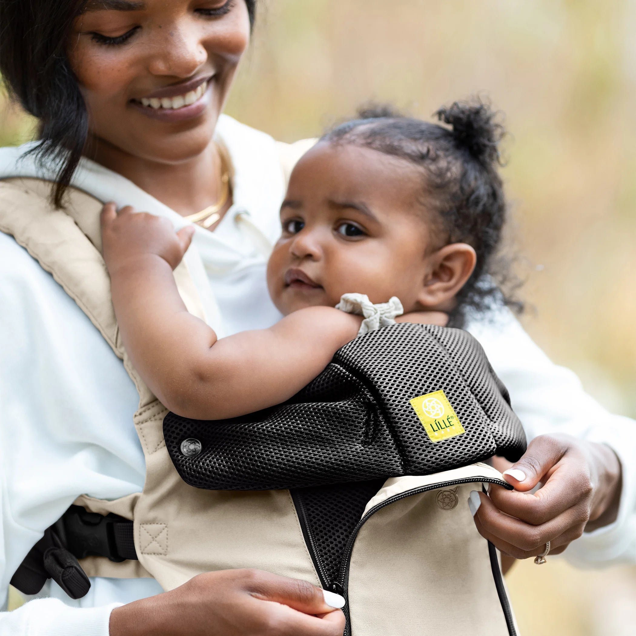 Mom wearing baby in Lillebaby Complete 6-in-1 All Seasons Carrier in Moonbeam