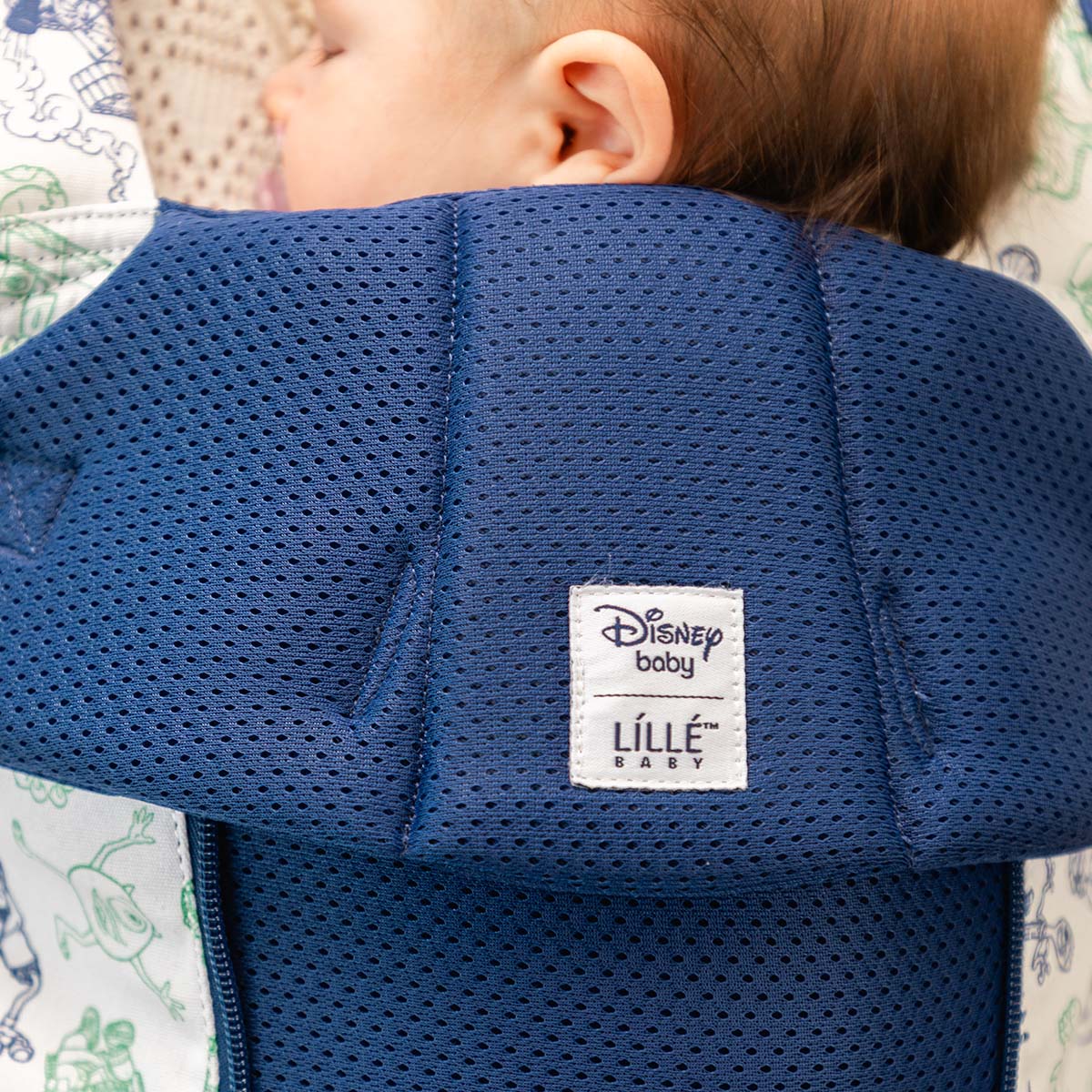 mom wearing baby in Complete 6-in-1 All Seasons in pixar team up baby carrier