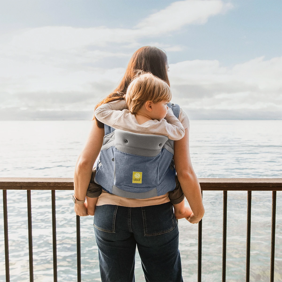 mom wearing baby in CarryOn Airflow DLX in Chambray