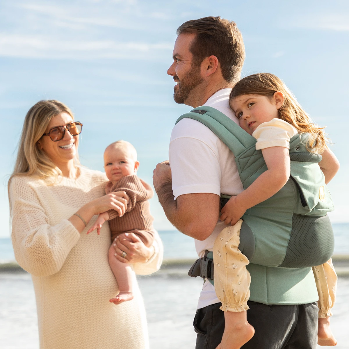 dad wearing baby in CarryOn Airflow DLX in Willow while mom is holding baby