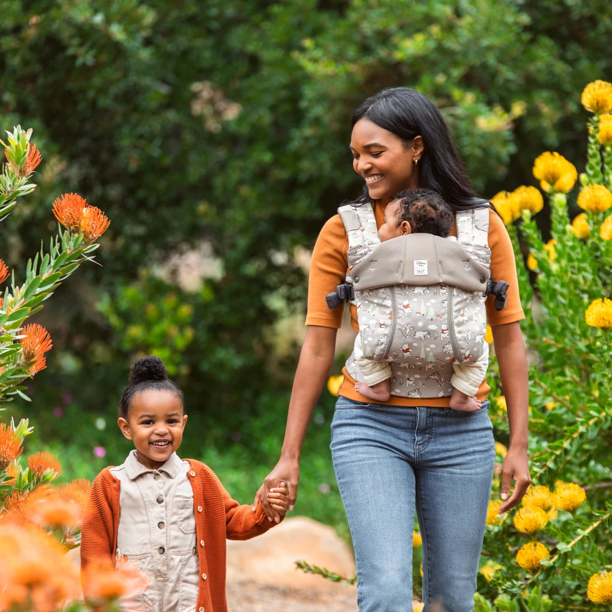 mom wearing baby in Complete 6-in-1 All Seasons in Pooh's Perfect Day baby carrier