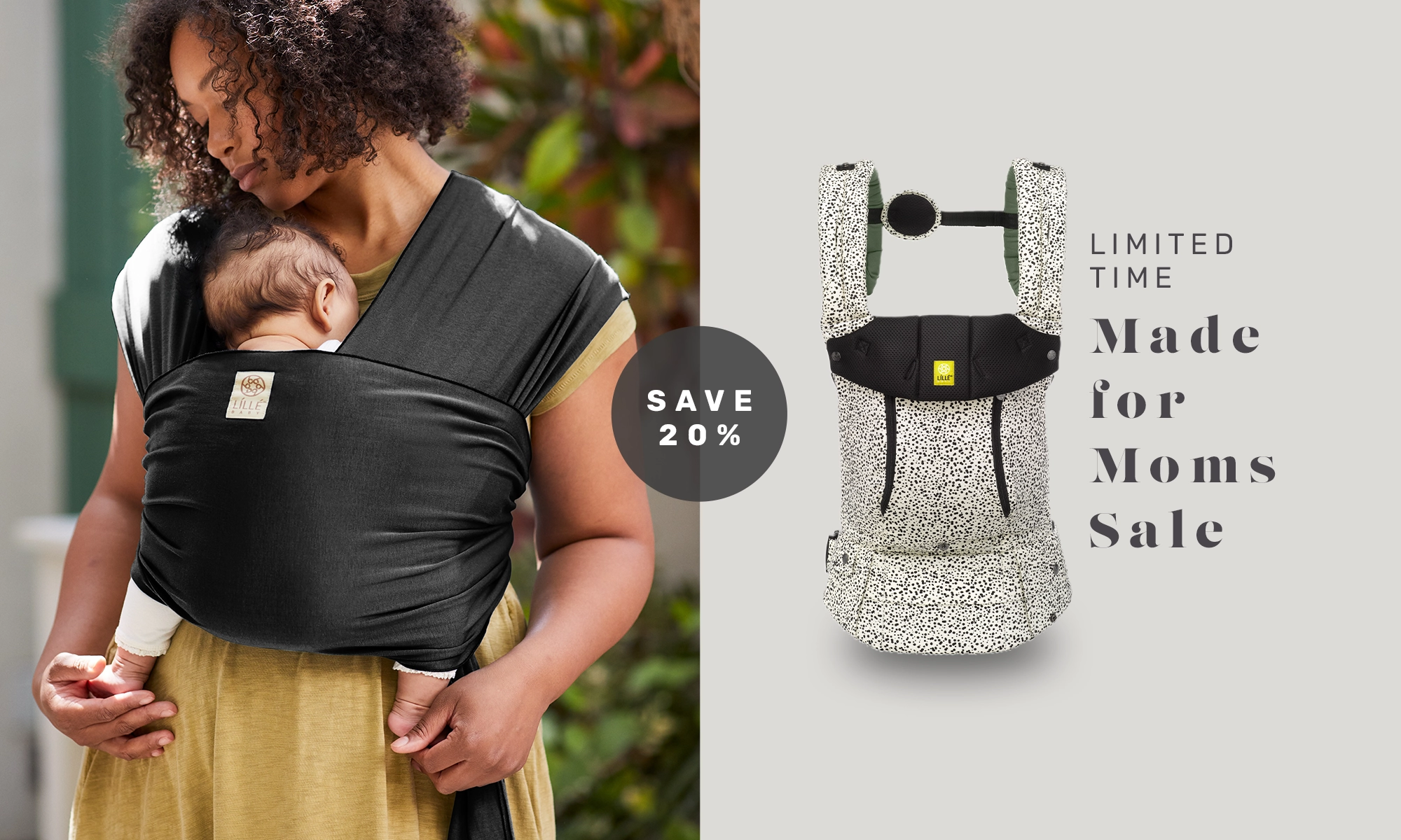 mom wearing baby in dragonfly wrap in black. save 20% on limited time made for moms sale. complete all seasons baby carrier in salt & pepper