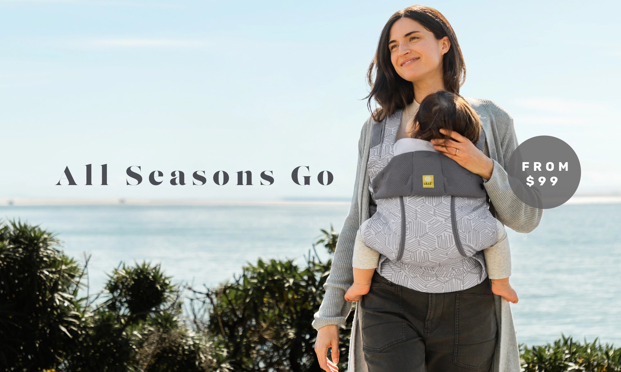 all seasons go. complete all seasons baby carriers starting from $99. mom wearing baby in complete all seasons in pebble grey