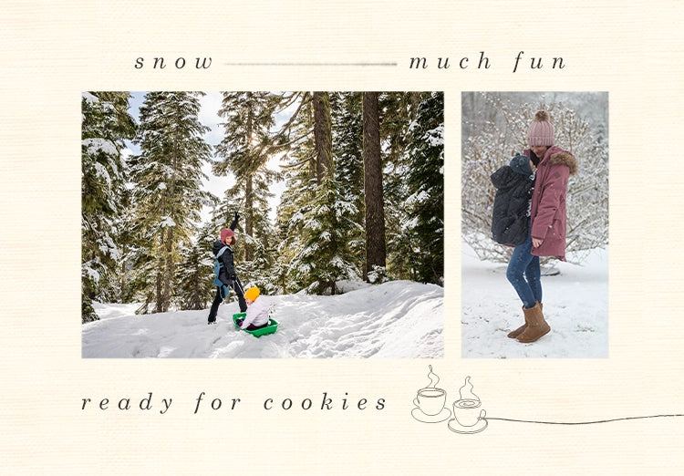 snow much fun ready for cookies. mom wearing baby in baby carrier playing with kids in the snow