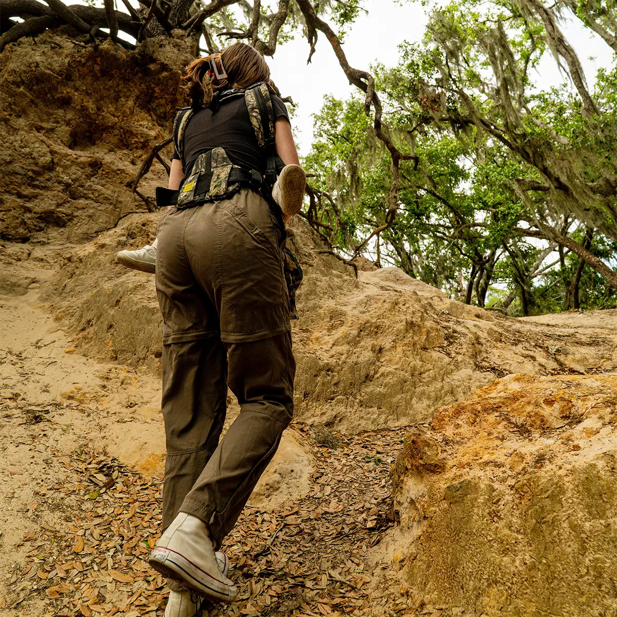mom wearing toddler in carryon airflow dlx in collaboration with mossy oak