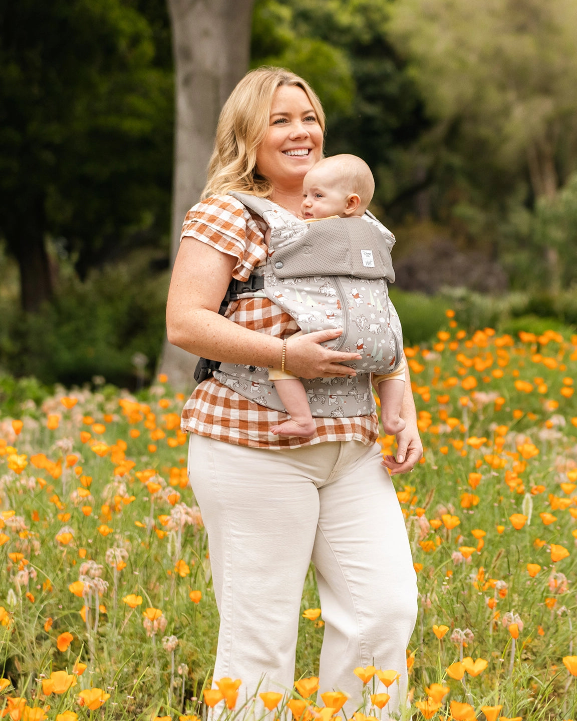 mom wearing baby in complete all seasons carrier in Pooh's Perfect Day