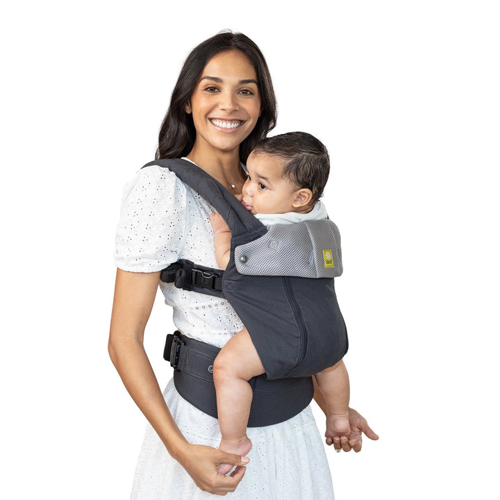 mom wearing lillebaby complete all seasons baby carrier in charcoal silver