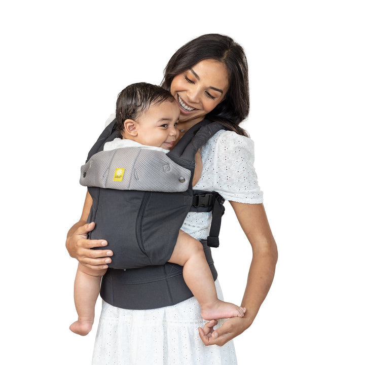 mom wearing lillebaby complete all seasons baby carrier in charcoal silver