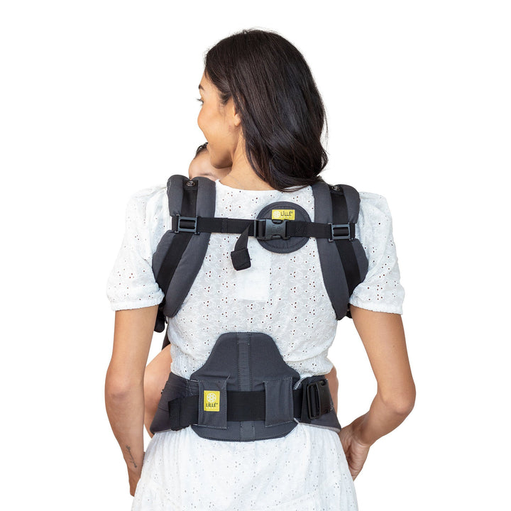 back image of mom wearing lillebaby complete all seasons baby carrier in charcoal silver
