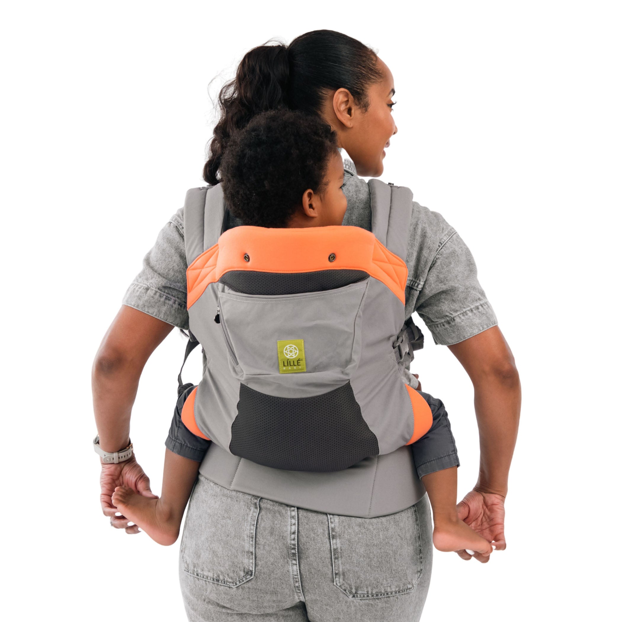mom wearing baby in carryon airflow dlx baby carrier in sunstone
