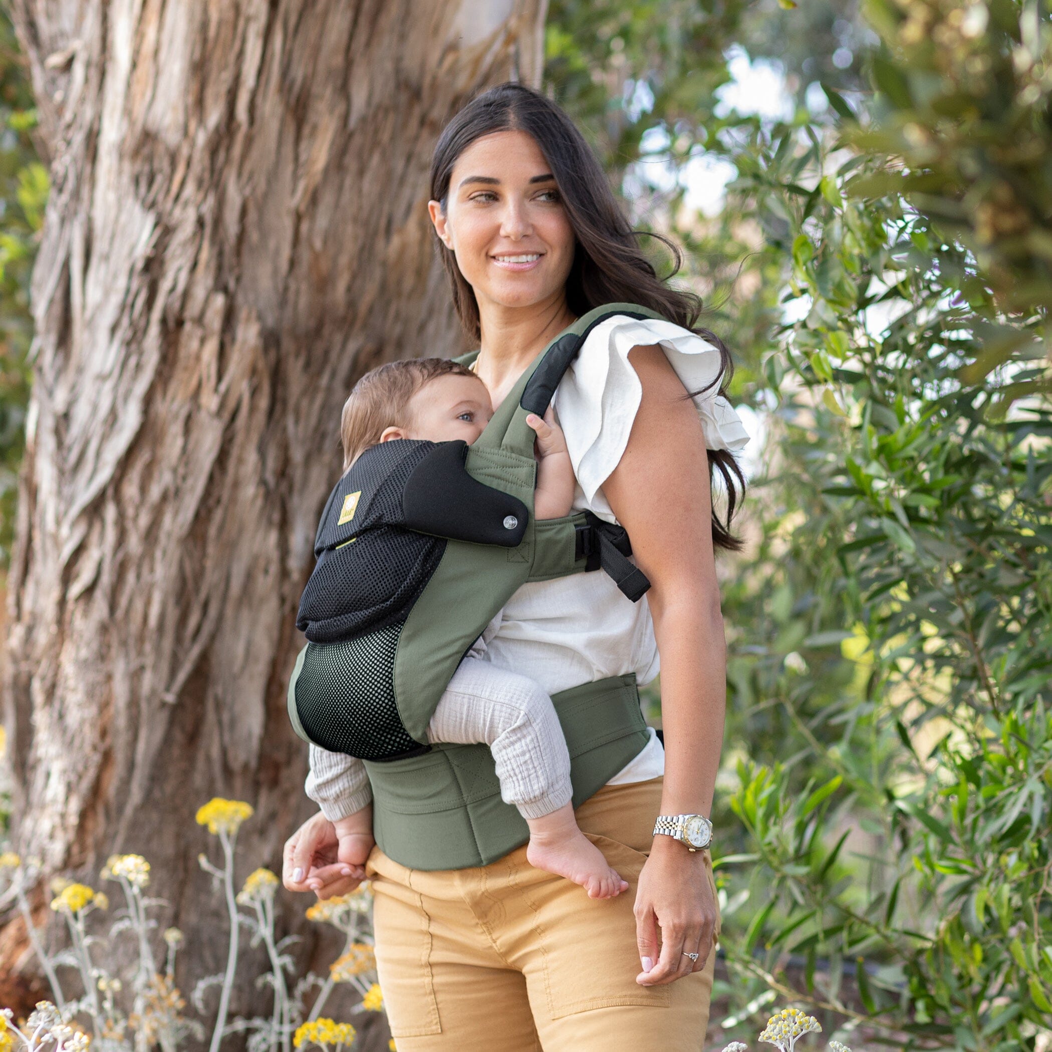 mom wearing baby in complete airflow dlx in olive