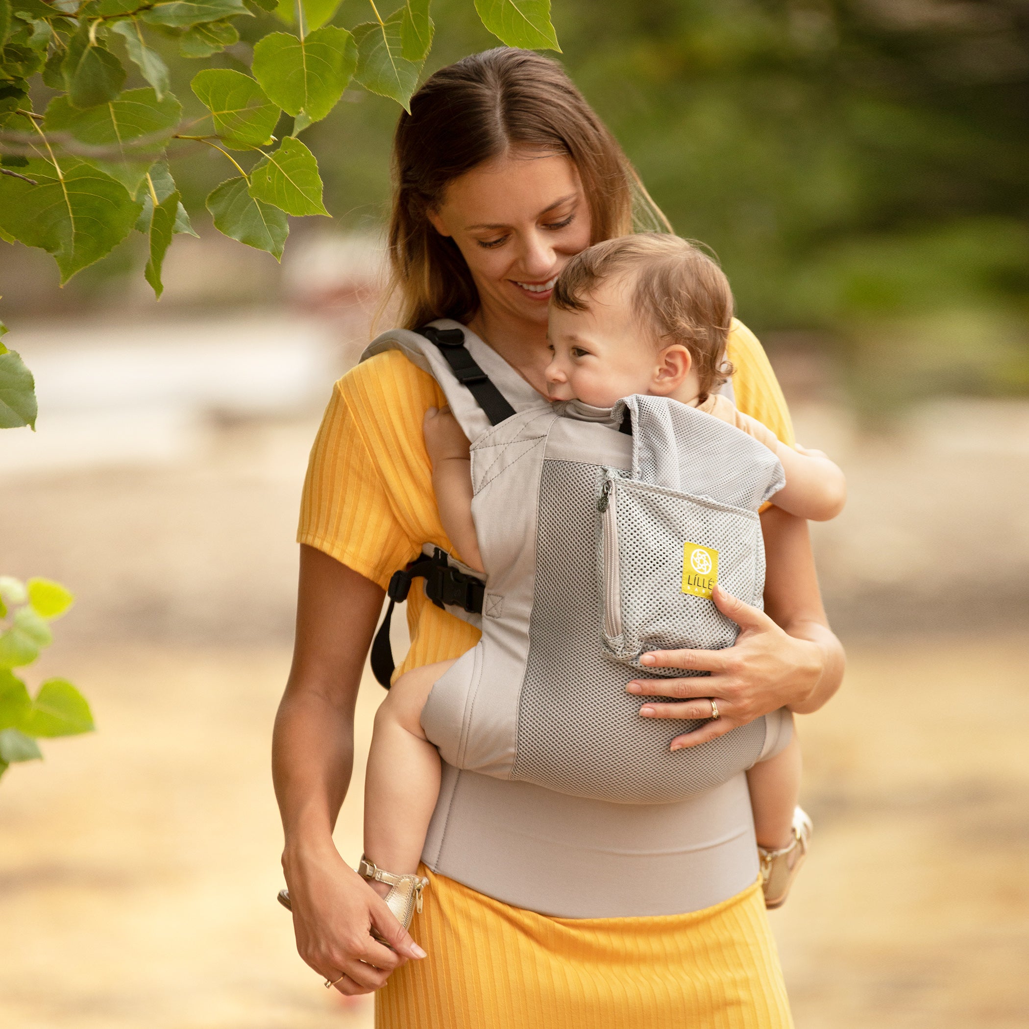 mom wearing baby in lillebaby's carryon airflow in mist
