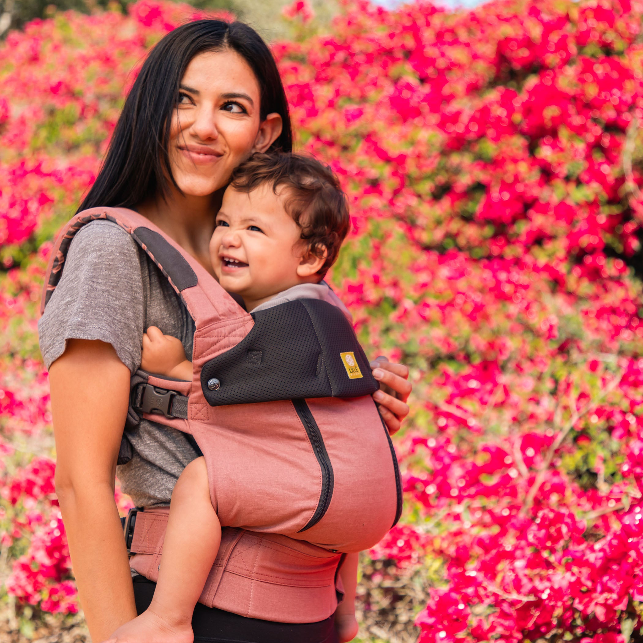 mom wearing baby in complete all seasons in moroccan clay