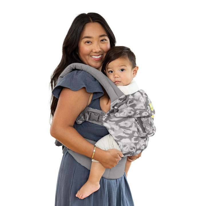 side profile image of mom wearing baby in lillebaby complete airflow baby carrier in frosted leopard