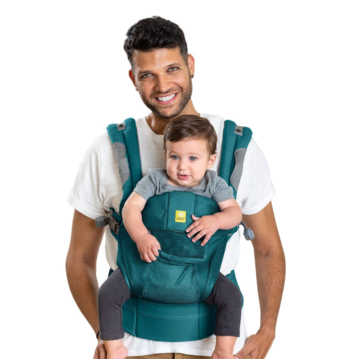 dad wearing baby in lillebaby complete airflow baby carrier in pacific coast