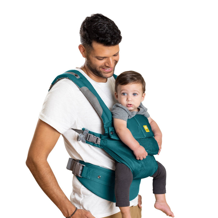 side profile image of dad wearing lillebaby complete airflow baby carrier in pacific coast