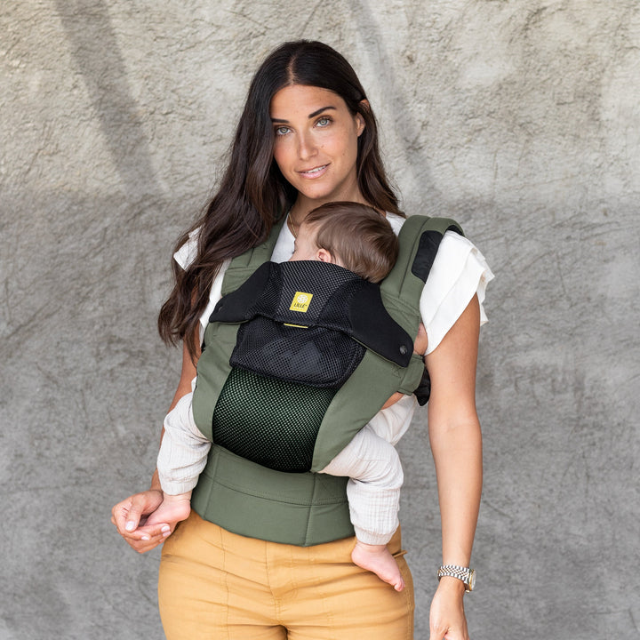 mom wearing baby in lillebaby complete airflow dlx baby carrier in olive black