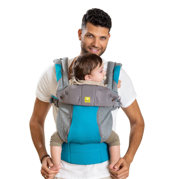dad wearing lillebaby complete all seasons baby carrier in cool carribean