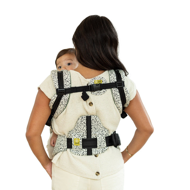 back image of mom wearing baby in lillebaby complete all seasons baby carrier in salt and pepper