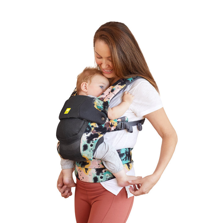 side profile image of mom wearing baby in lillebaby complete airflow dlx baby carrier in watercolor space dye